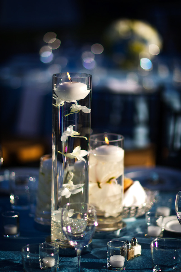 beautifully delicate reception centerpieces - white floating flowers and floating candles - photo by Washington DC based wedding photographers Holland Photo Arts